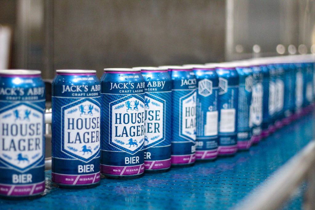Cans of House Lager being packaged on our canning line